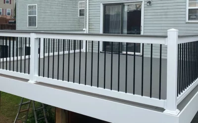 The Risks of Installing Aluminum Balusters in Pressure Treated Railing on a Deck